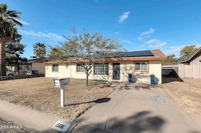 view of front of property with solar panels