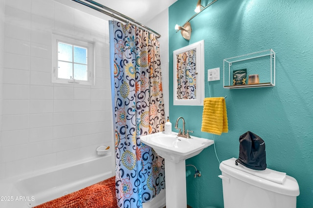 bathroom featuring toilet and shower / bath combo