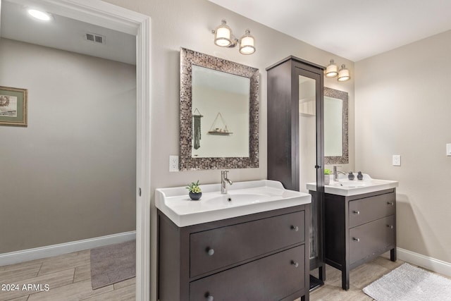 2520 E Flower St, Phoenix, AZ 85016 - bathroom featuring hardwood / wood-style floors and vanity
