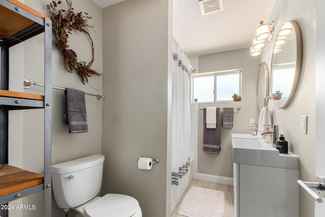 2520 E Flower St, Phoenix, AZ 85016 - bathroom with vanity and toilet