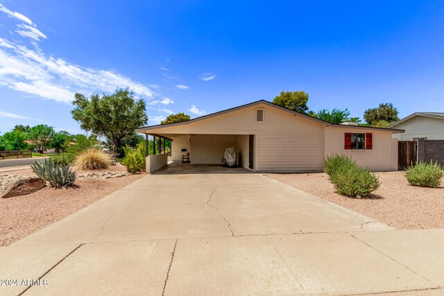 view of property exterior with a carport