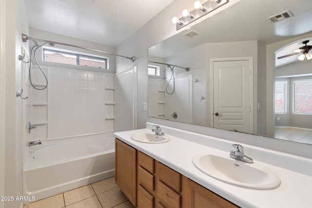 bathroom with tile patterned flooring, vanity, bathtub / shower combination, and ceiling fan