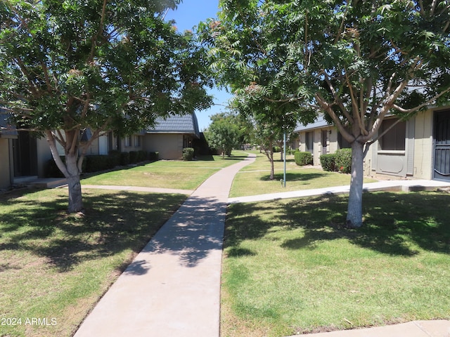 view of home's community featuring a yard