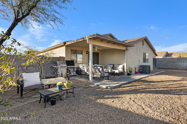 back of house featuring cooling unit, ceiling fan, and a patio area