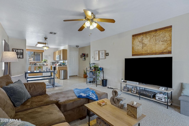 living room with ceiling fan