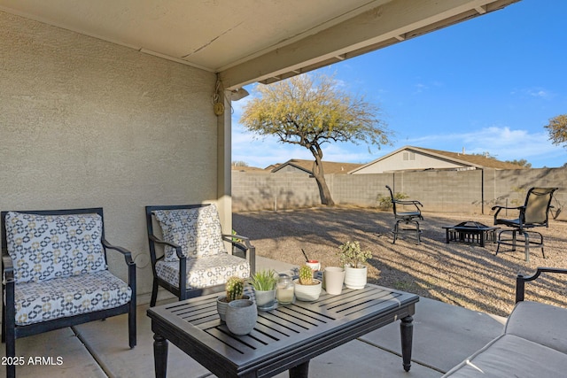 view of patio with an outdoor fire pit