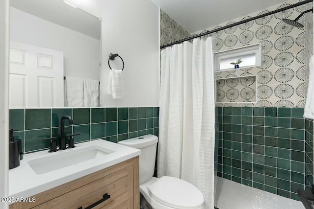 bathroom featuring vanity, tile walls, a shower with shower curtain, and toilet