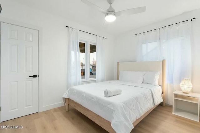 bedroom featuring ceiling fan and light hardwood / wood-style floors