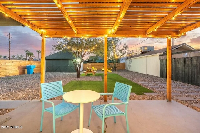 patio terrace at dusk with a pergola