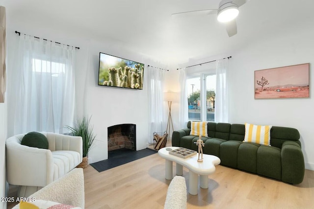 living room featuring hardwood / wood-style flooring and ceiling fan