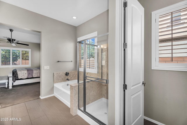 21004 E Sunset Dr, Queen Creek, AZ 85142 - full bathroom with ceiling fan, a wealth of natural light, connected bathroom, a stall shower, and baseboards