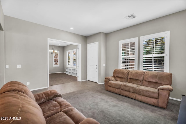 21004 E Sunset Dr, Queen Creek, AZ 85142 - tiled living room with visible vents, baseboards, an inviting chandelier, recessed lighting, and carpet flooring