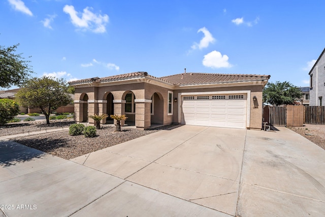 21004 E Sunset Dr, Queen Creek, AZ 85142 - mediterranean / spanish home with concrete driveway, stucco siding, an attached garage, a tiled roof, and fence