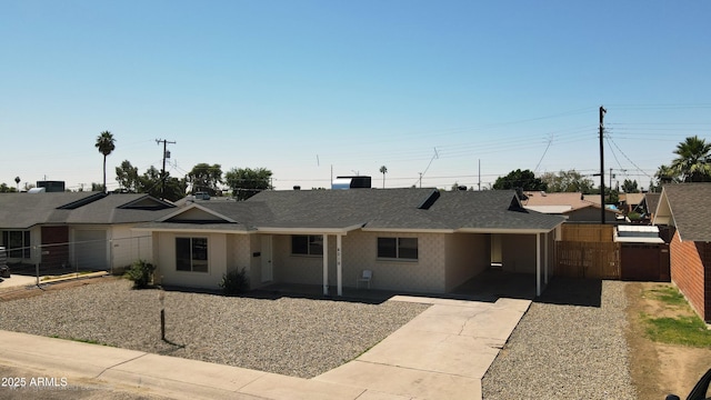4219 W Citrus Way, Phoenix, AZ 85019 - single story home with a shingled roof, driveway, fence, and an attached carport