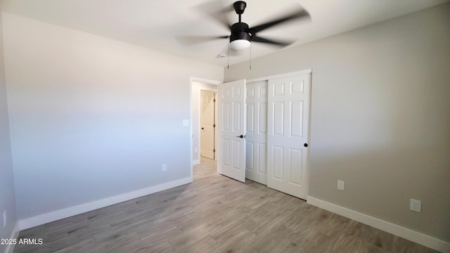 4219 W Citrus Way, Phoenix, AZ 85019 - unfurnished bedroom with baseboards, wood finished floors, a closet, and a ceiling fan