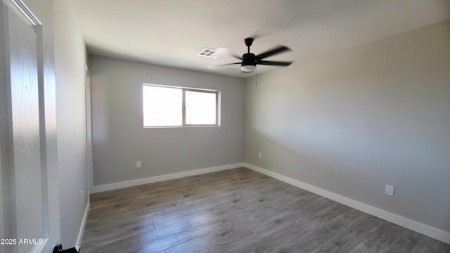 4219 W Citrus Way, Phoenix, AZ 85019 - empty room with a ceiling fan, wood finished floors, and baseboards