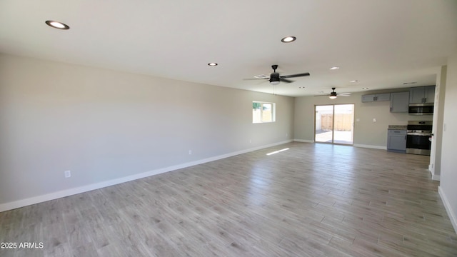 4219 W Citrus Way, Phoenix, AZ 85019 - unfurnished living room with recessed lighting, baseboards, a ceiling fan, and light wood-type flooring