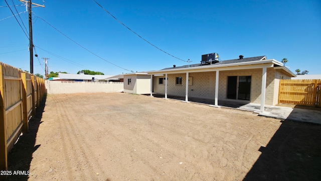 4219 W Citrus Way, Phoenix, AZ 85019 - back of house featuring a patio area, central AC, and a fenced backyard