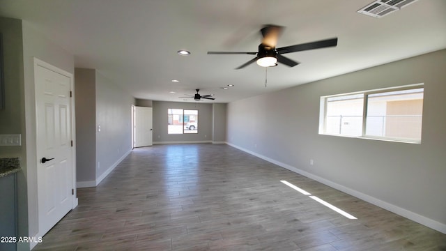 4219 W Citrus Way, Phoenix, AZ 85019 - unfurnished room featuring a ceiling fan, recessed lighting, baseboards, and wood finished floors