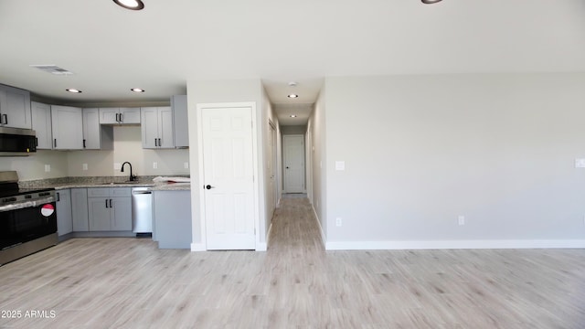 4219 W Citrus Way, Phoenix, AZ 85019 - kitchen featuring appliances with stainless steel finishes, gray cabinetry, light wood-type flooring, baseboards, and recessed lighting