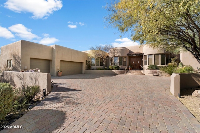 southwest-style home featuring a garage