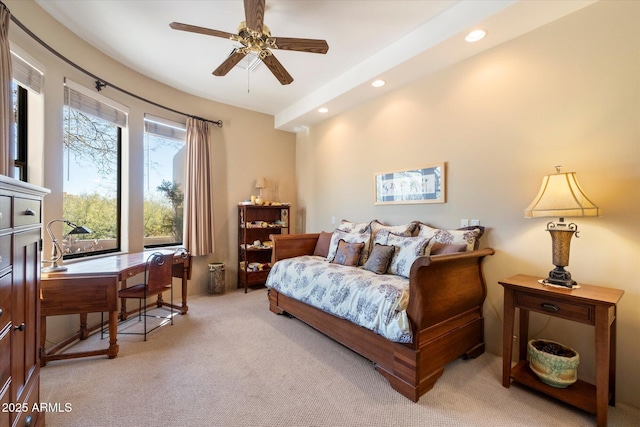 bedroom featuring ceiling fan and light carpet