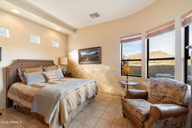 bedroom with light tile patterned floors