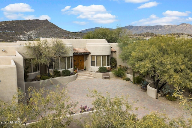 back of house featuring a mountain view