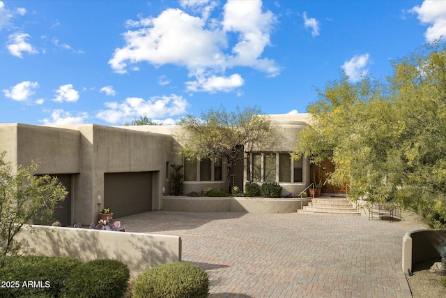 adobe home featuring a garage