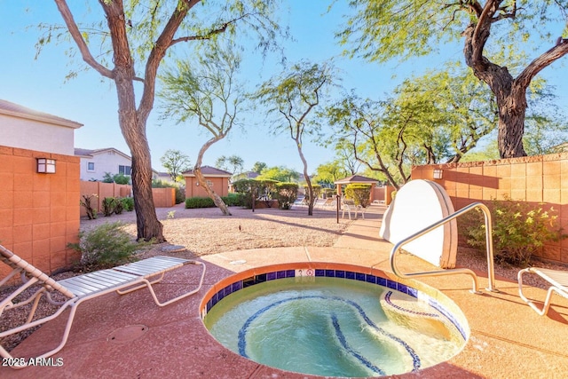 view of swimming pool featuring a shed, fence, an outdoor structure, and an in ground hot tub