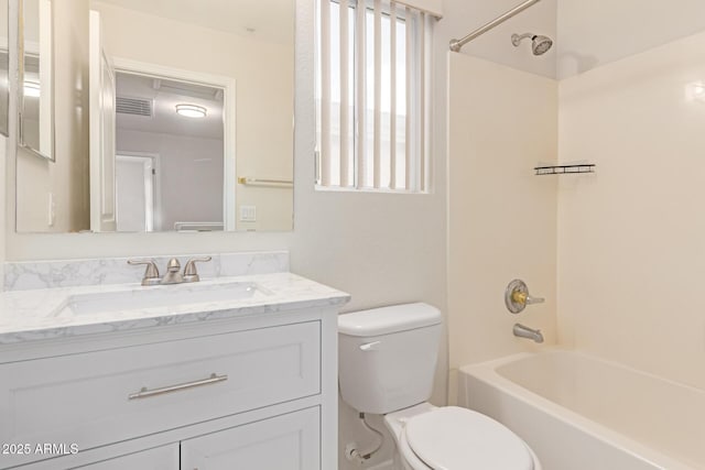 bathroom with toilet, washtub / shower combination, vanity, and visible vents