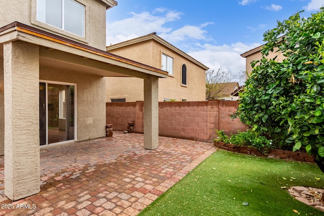 view of patio featuring fence