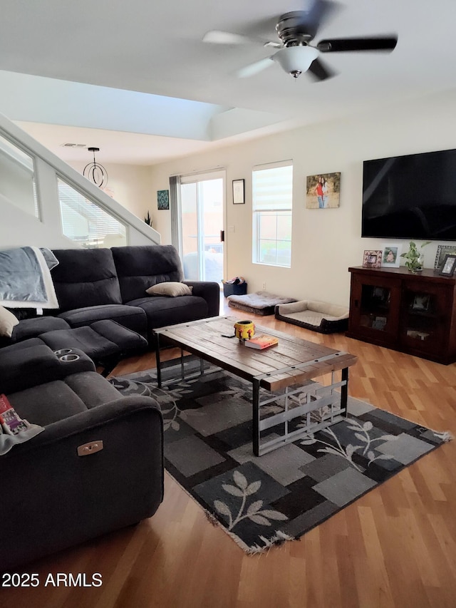 living area featuring ceiling fan and wood finished floors