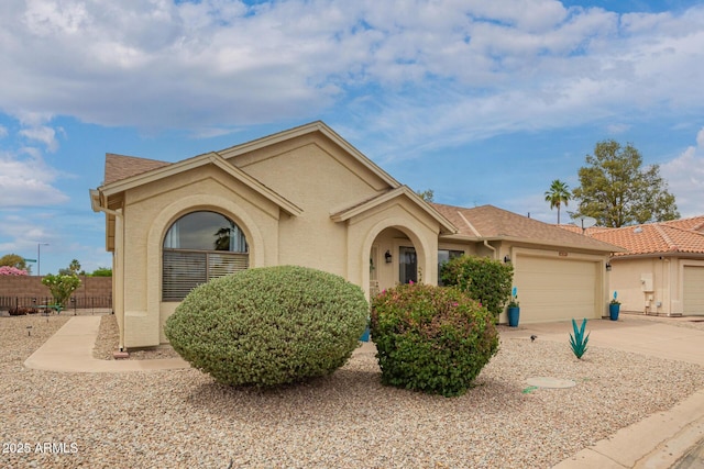6160 S Pebble Beach Dr, Chandler, AZ 85249 - mediterranean / spanish-style house featuring a garage, stucco siding, concrete driveway, and a shingled roof