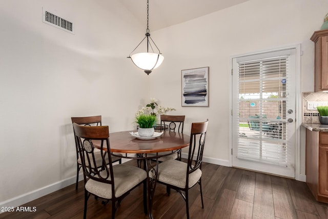 6160 S Pebble Beach Dr, Chandler, AZ 85249 - dining room with dark wood finished floors, baseboards, and vaulted ceiling