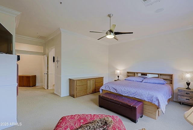 carpeted bedroom with visible vents, ornamental molding, and a ceiling fan