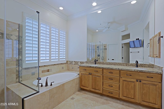 bathroom featuring a ceiling fan, a sink, a bath, and a shower stall