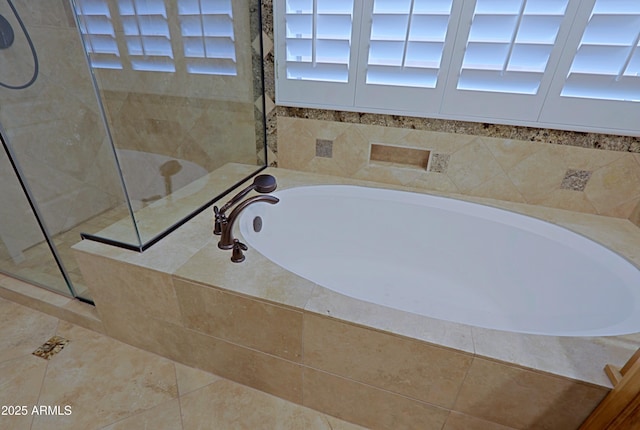 full bath featuring tile patterned flooring, a walk in shower, and a bath