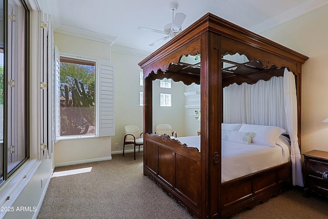 carpeted bedroom featuring crown molding and baseboards