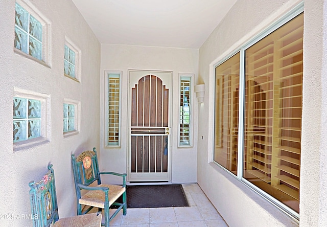 doorway to property with stucco siding