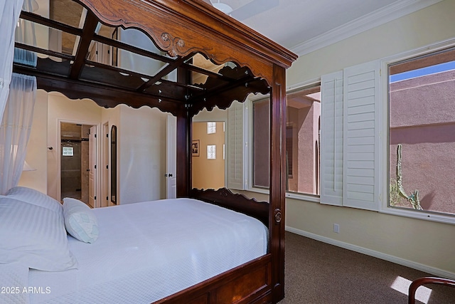 carpeted bedroom with crown molding and baseboards