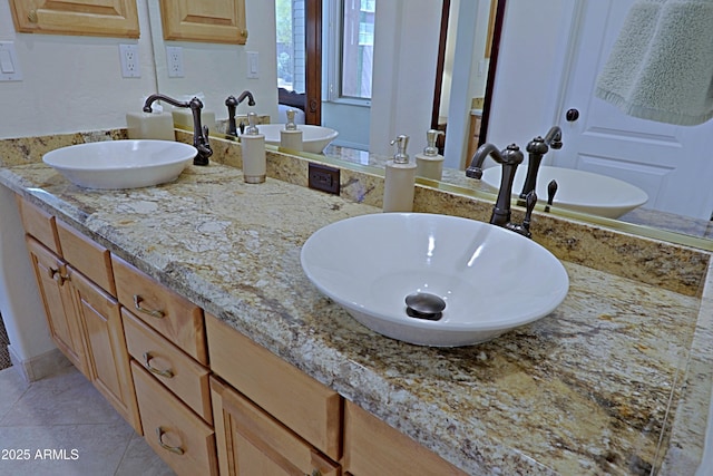 bathroom with double vanity and a sink