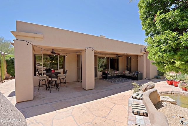 view of patio / terrace featuring ceiling fan, an outdoor hangout area, and outdoor dining space