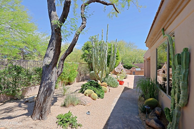 view of yard featuring a patio and a fenced backyard