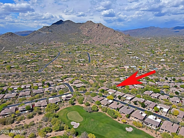 aerial view with a residential view, a mountain view, and golf course view