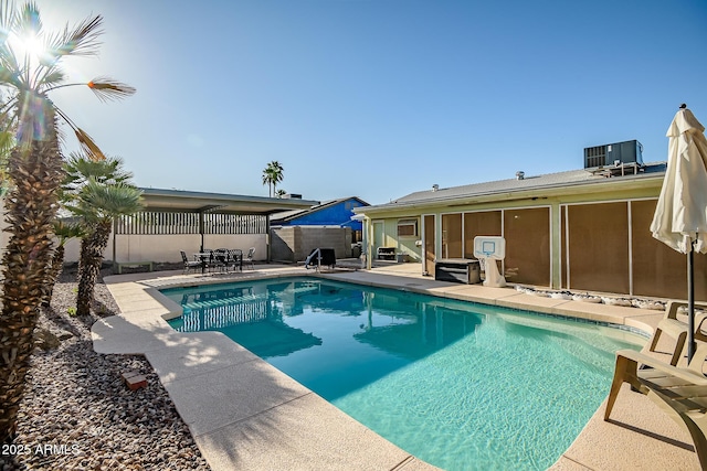view of swimming pool with a patio, a fenced backyard, a fenced in pool, and central AC unit