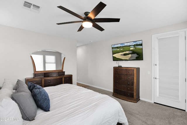 bedroom with ceiling fan and carpet floors