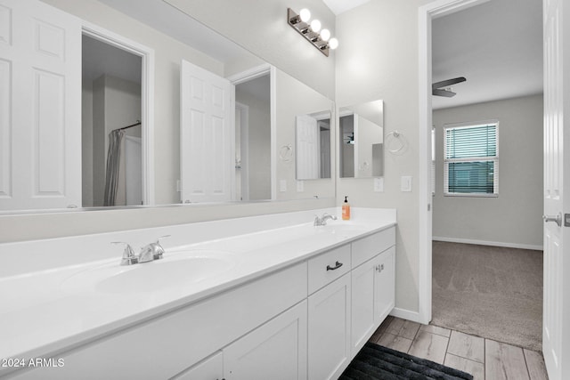 bathroom with vanity and ceiling fan