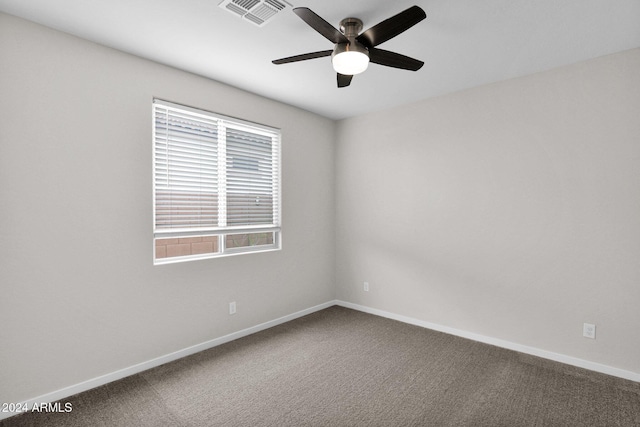 empty room featuring carpet and ceiling fan