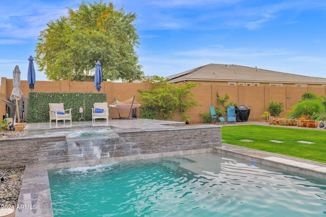 view of swimming pool with pool water feature, a patio, and grilling area